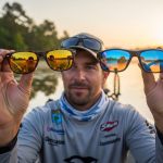 Angler wearing polarized sunglasses while bass fishing in freshwater lake